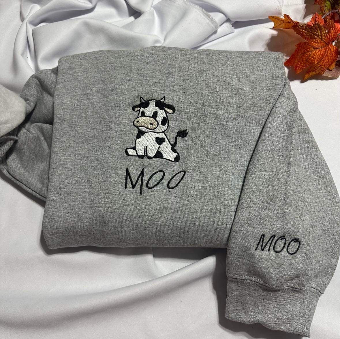 Cow embroidered Sweatshirt,  Sitting cow with MOO embroidered on the cuff of the crewneck, Christmas Fall aesthtic shirts