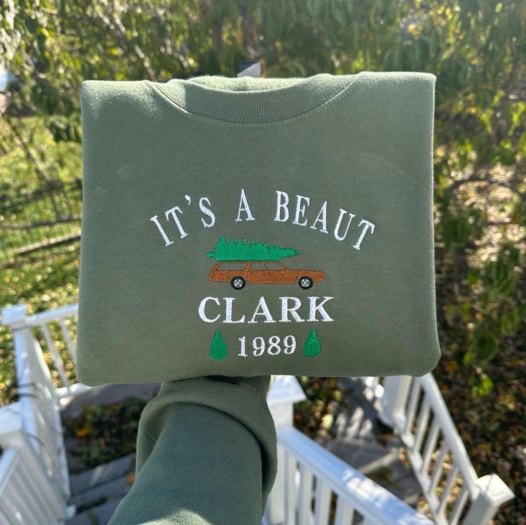 It's a Beaut Clark Embroidered Christmas Sweatshirt