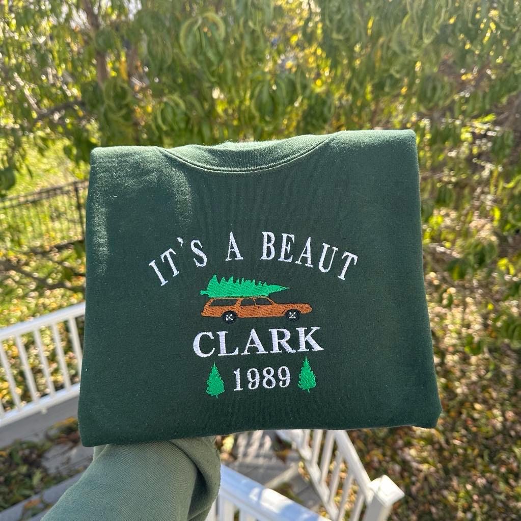It's a Beaut Clark Embroidered Christmas Sweatshirt
